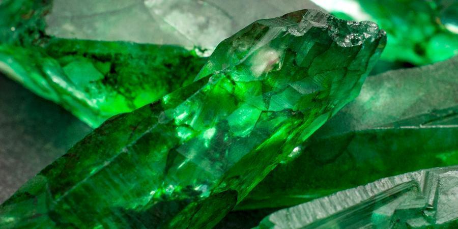 uncut raw emerald crystals and gemstones