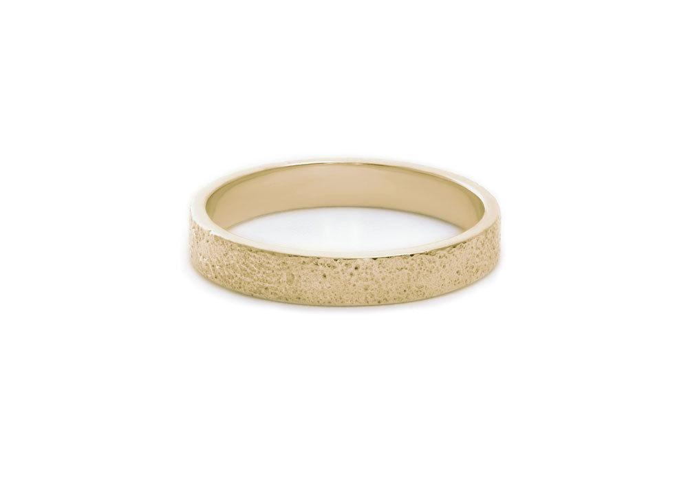 single crosspiece yellow gold wedding rings woman unique texture