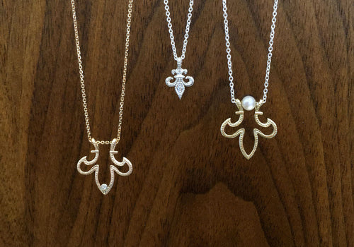 three models sterling silver fleur-de-lys pendant 