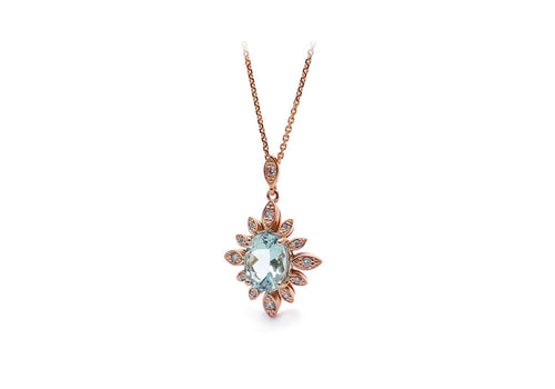 Pendant the big blue one under the sun. Pink gold pendant with oval aquamarine in the center and laboratory grown diamonds.